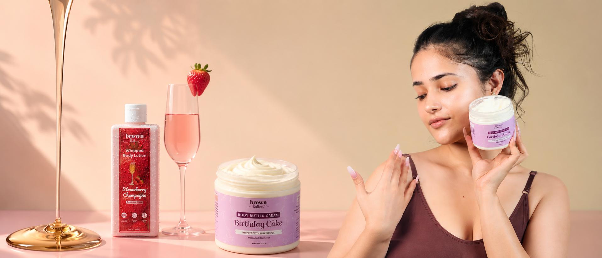 Open jar of Strawberry Cheesecake whipped bath butter with pink and cream swirl beside a cheesecake slice