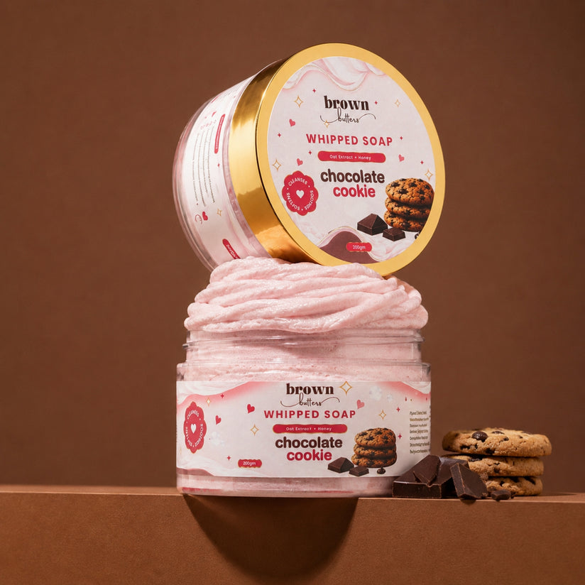 Brown Butters Chocolate Cookie Whipped Soap jar with lid propped open, styled with cookies and dark chocolate
