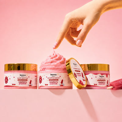 Brown Butters Raspberry Popsicle Dessert Spa Trio on pink, a popsicle stick dipped in the whipped soap.