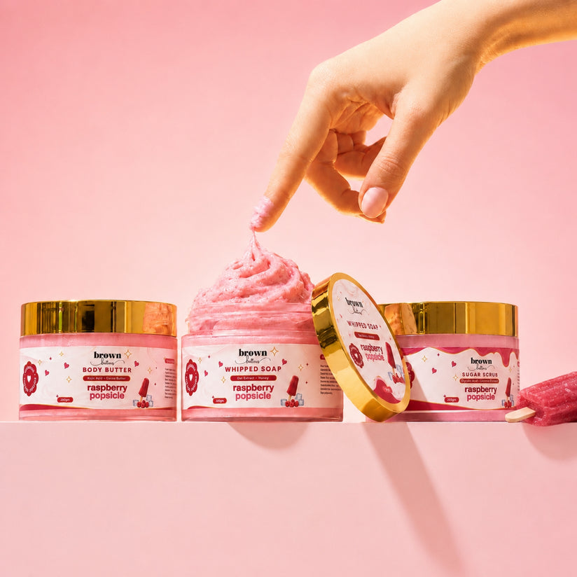 Brown Butters Raspberry Popsicle Dessert Spa Trio on pink, a popsicle stick dipped in the whipped soap.
