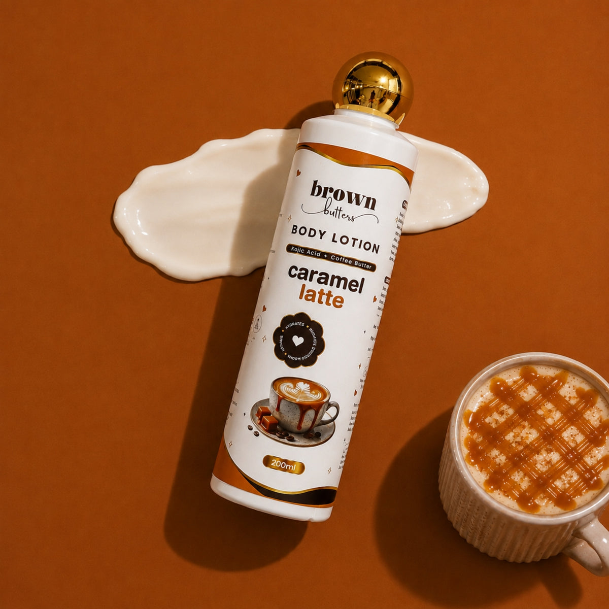 Brown Butters Caramel Latte Body Lotion bottle on warm brown with a cream smear and a caramel drizzled latte