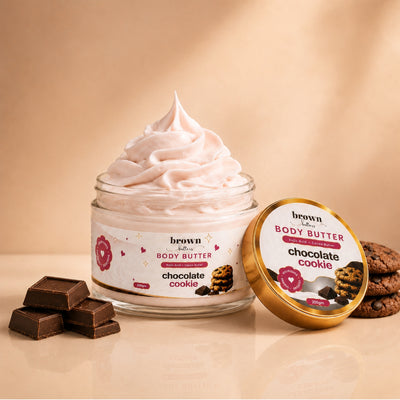 Brown Butters Chocolate Cookie Body Butter jar of whipped cream with gold lid, cookies and chocolate on beige