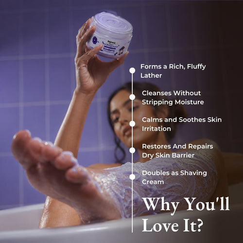 Brown Butters Blueberry Cheesecake Whipped Soap held in a bathtub with a benefits list and purple tiled walls