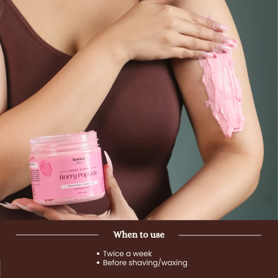 Brown Butters Berry Popsicle Body Scrub swiped along an arm in a when to use application shot