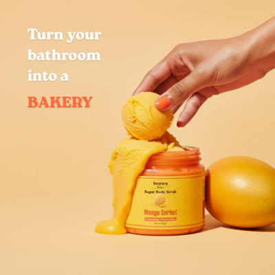 Brown Butters Mango Sorbet Sugar Body Scrub scooped like sorbet over the jar, bathroom turned bakery